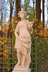 Wall Mural - Statue of goddess Flora in Summer Garden.