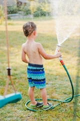 Wall Mural - Portrait of a boy in the summer outdoors