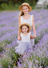 portrait of two sisters in a lavender field