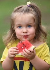 portrait of little girl outdoors in summer