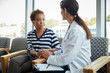 © Gregory Miller - Female patient speaking with doctor