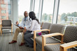 © Gregory Miller - Doctor speaking with patient