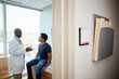 © Gregory Miller - Doctor talking with male patient