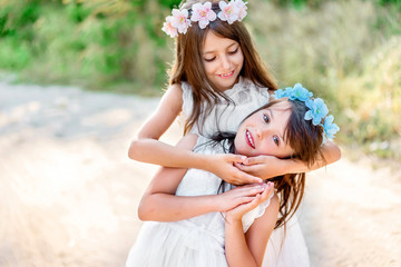 Portrait of two girls in the woods girlfriends