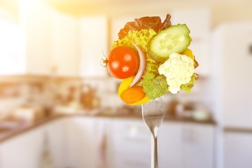 Wall Mural - Fresh variety vegetables on fork, soft blue background