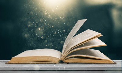 Wall Mural - open book on old wooden table