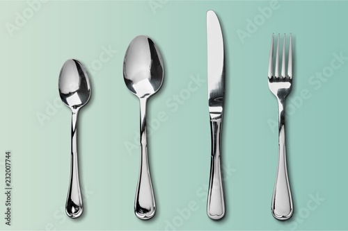 Cuadros en Lienzo Fork, spoon and knife on blue background