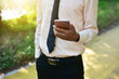 © Suriyo - Businessman holding smart phone and using  internet online