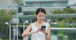 © leungchopan - Woman use of smart phone in city
