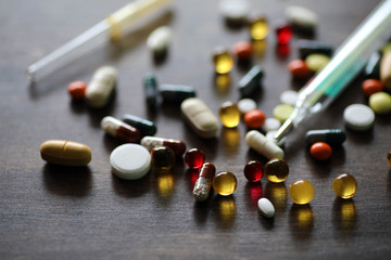 Wall Mural - Medications and tablets on a wooden texture table