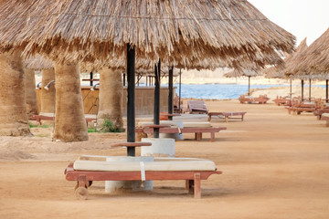 View of beach with sun umbrellas and loungers