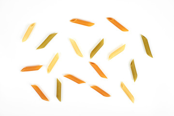 Wall Mural - raw penne colorful pasta on white background.