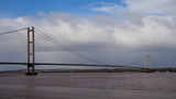 Humber Bridge, a single span suspension bridge spanning the River Humber, viewed from Barton-on-Humber, Lincolnshire looking back towards Hessle, Yorkshire, UK
