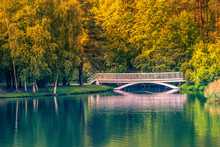 Old Small White Bridge Over Lake At Sunny Autumn Day