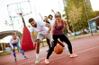© BGStock72 - Group of multiethnic people  playing basketball on court