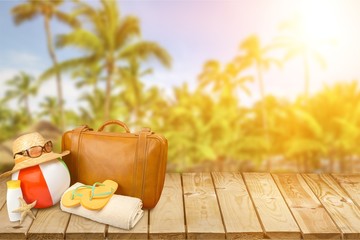 Wall Mural - Beach Ball, Suitcase, Towel, Sun Hat, Flip-Flops and Sun Cream