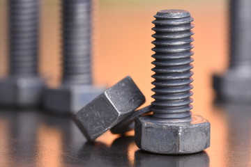 Steel bolt and nut closeup with blurred background