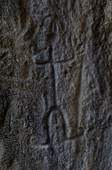 Neolithic rock paintings of Gobustan National Park, depicting dancing shaman holding spear in his hand, Azerbaijan,Caucasus,unesco heritage site