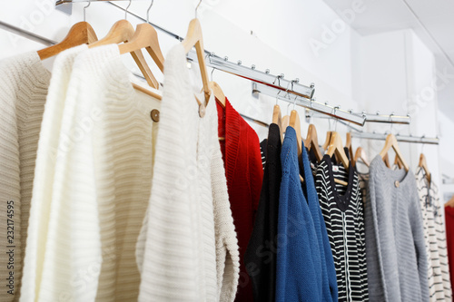 Fotografia Clothes on hangers and shelfs in boutique