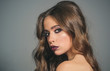 © Volodymyr - woman with fashion makeup and long curly hair. Beauty salon and hairdresser. Makeup cosmetics and skincare. Fashion portrait of woman. fashion girl with glamour makeup. Glamour fashion model