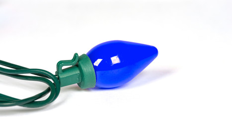 Wall Mural - blue retro led bulb light isolated on white with a shallow depth of field