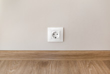 Electric Socket Mounted On Wall At Modern Flat