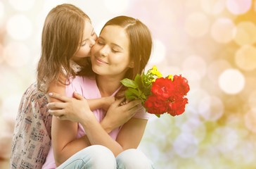 Sticker - Portrait of happy mother and daughter holding  flowers