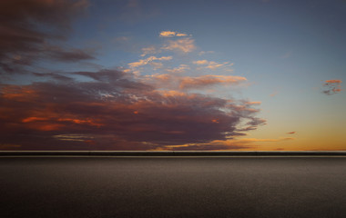 Wall Mural - empty floor with beautiful colorful clouds early morning sky