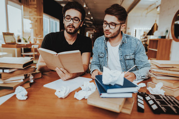 Wall Mural - Two Concentrated Text Writers Working Together