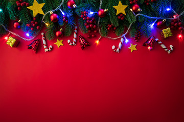 christmas background concept. top view of christmas gift box red sock with spruce branches, pine con