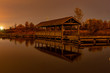 Wooden pier on the lake after sunset.