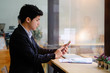 © Prathankarnpap - Asian businessman using smartphone mobile.