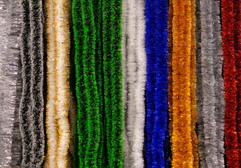 Bright background Christmas tinsel multi-colored, rainbow. Christmas decor, xmas tree decorations