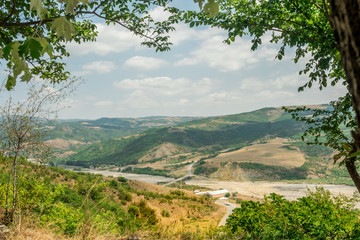 Landscape with mountain and river with natural Tree Leaves Border or frame. Place for copyspace.