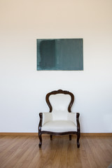 Wall Mural - Empty room with armchair and white wall. Abstract accommodation. Minimalism in lodging.