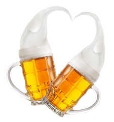 Two faceted mugs of beer with splashes of foam in shape of heart