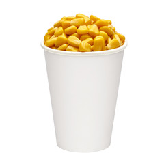 Boiled corn kernels in cardboard cup side view isolated on white background.