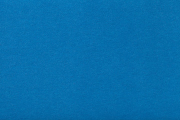 Light blue matt suede fabric closeup. Velvet texture of felt.