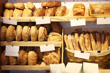 Fresh bread on shelves in a bakery cafe