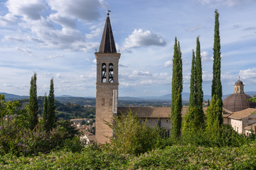 Wall Mural - View of the bell tower of the the medieval Cathedral of Santa Maria Assunta and the hills of Umbria. Spoleto, Italy