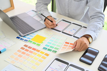 UI Designer drawing website UX layout app development.