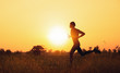 © sutadimages - The Runners man handles water bottle Running at sunset time.