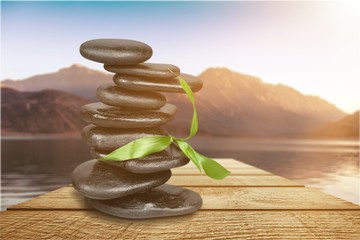 Poster - Zen basalt stones and leaves on background