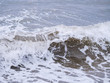 Waves at the seashore. Selective focus with shallow depth of field.