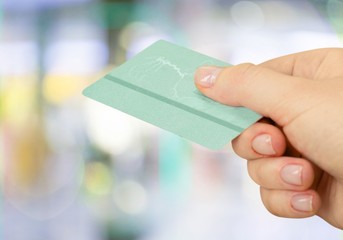 Wall Mural - Close up of woman hand holding credit card