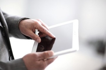 Wall Mural - close up.businessman presses on the screen of a digital tablet.p