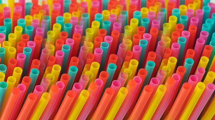 Abstract prismatic representation of one-use colorful plastic drinking straws, concept for excessive use of plastic, single use plastic ban, environmental  pollution or recycling issues