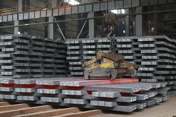 Hot ingot in a steel plant, closeup of photo