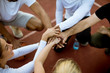 © BGStock72 - Top view of basketball team holding hands over court
