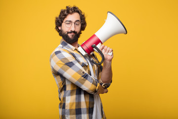 Wall Mural - young crazy mad man  fool pose with a megaphone. announcement co